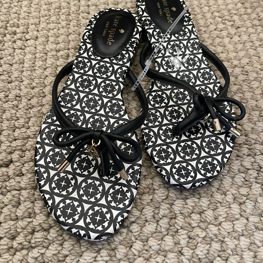 Brand new Kate Spade flip flops, never worn, size 7.5